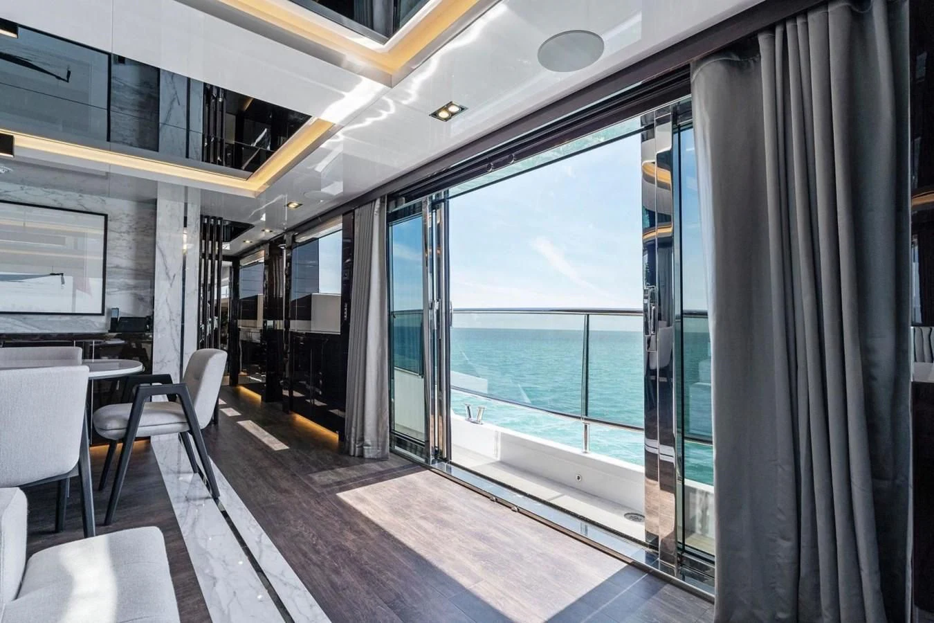 a room with a large window and a view of the water aboard KNEAD IT Yacht for Sale