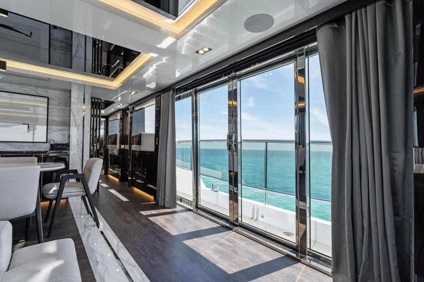 a room with a glass door and windows aboard KNEAD IT Yacht for Sale