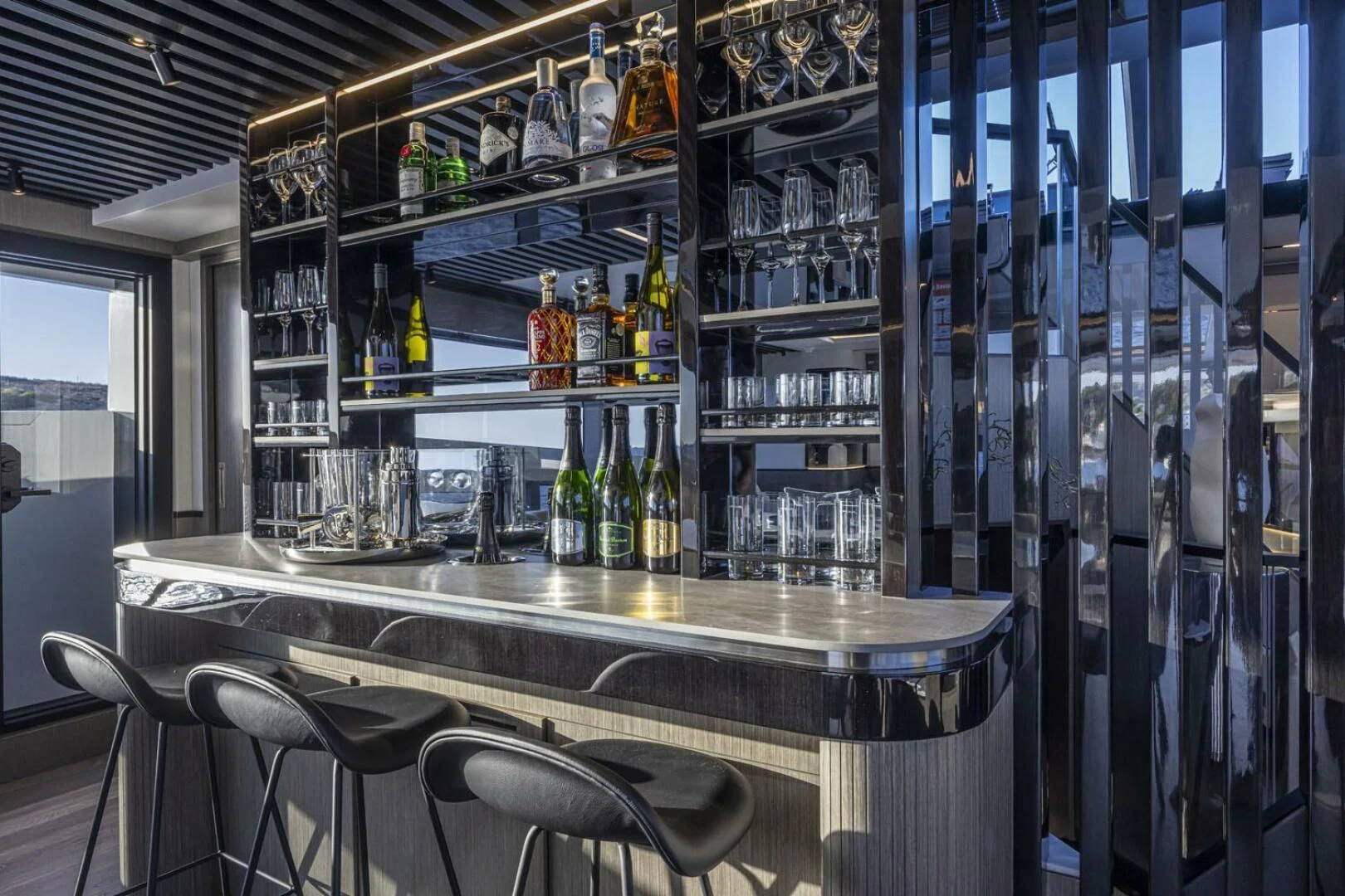a bar with shelves of bottles aboard KNEAD IT Yacht for Sale