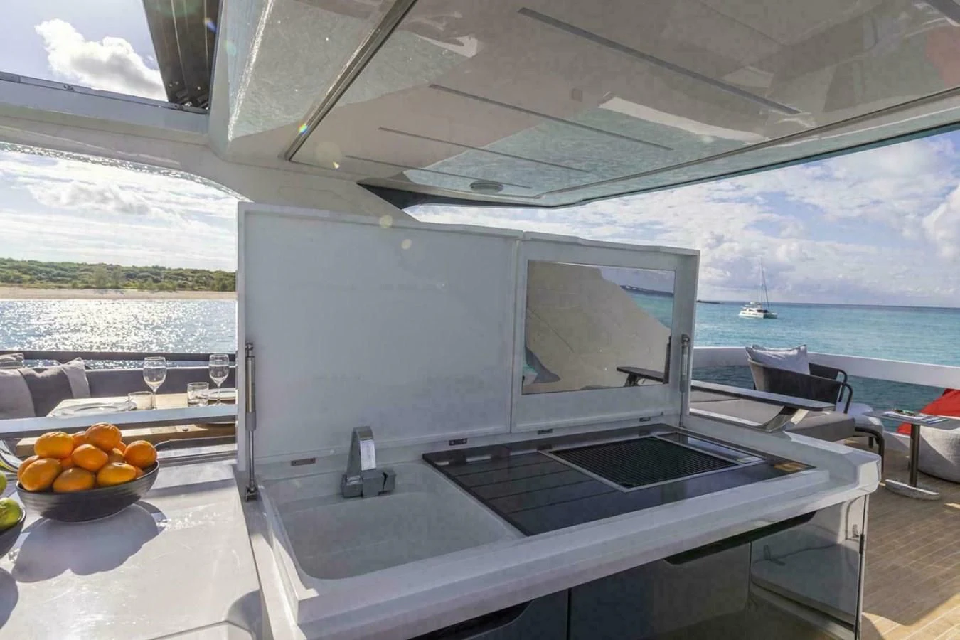 a modern kitchen with a large glass window aboard KNEAD IT Yacht for Sale