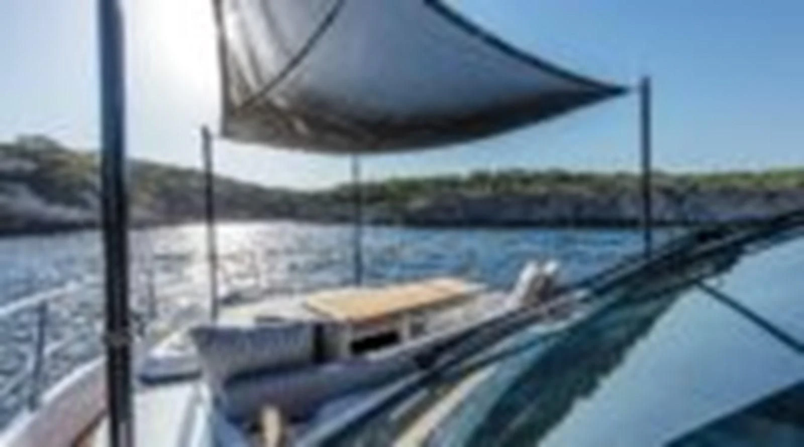 a covered dock over a lake aboard KNEAD IT Yacht for Sale