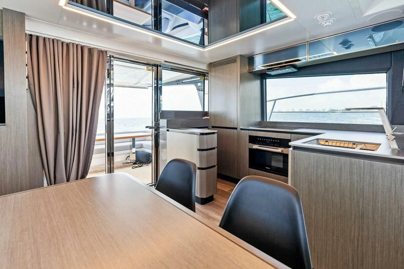 a room with a table and chairs aboard KNEAD IT Yacht for Sale