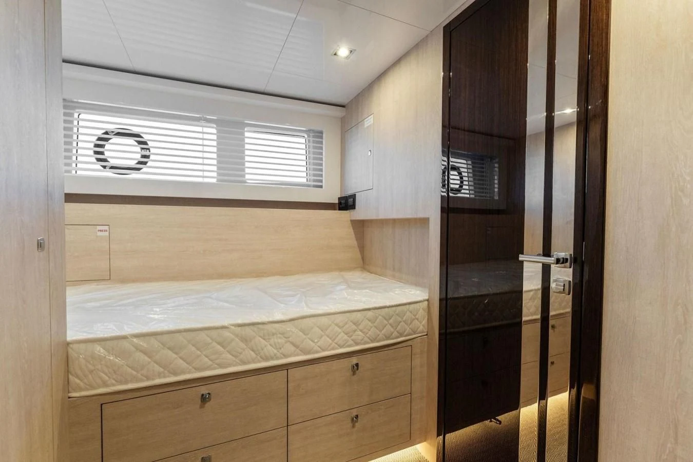 a room with a bed and a closet aboard KNEAD IT Yacht for Sale