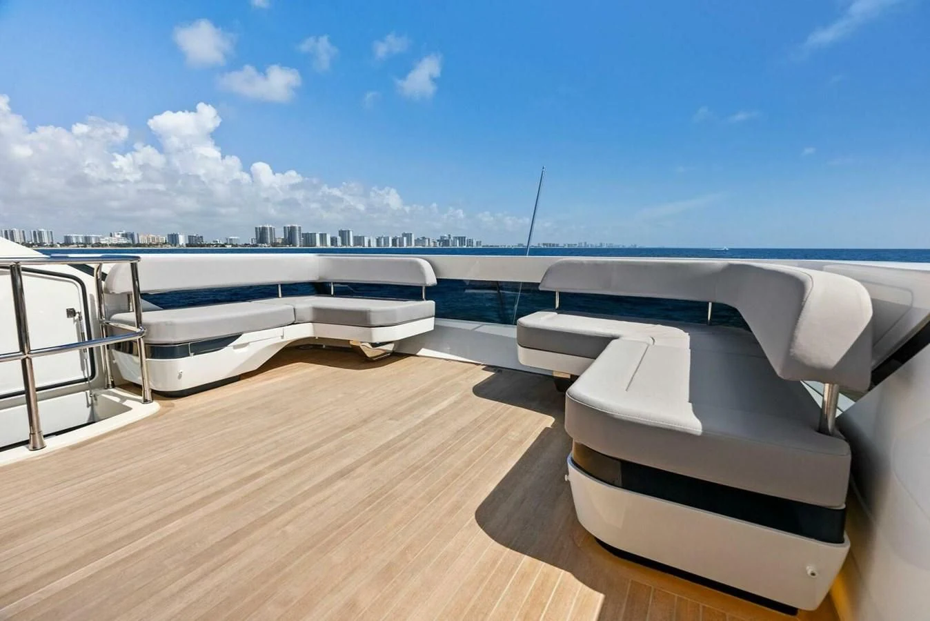 a deck with a deck and a view of the water aboard KNEAD IT Yacht for Sale