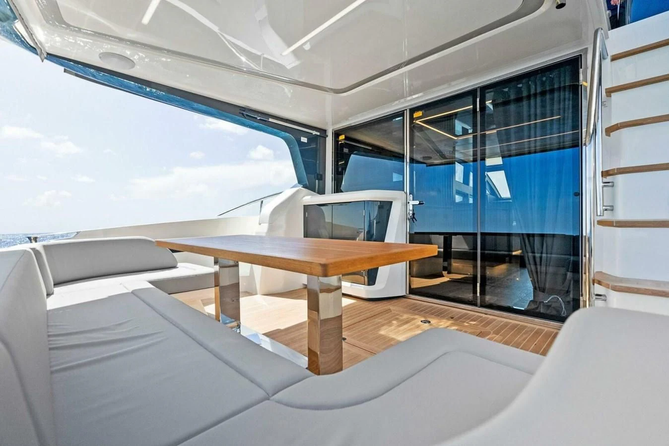 a room with a table and chairs aboard KNEAD IT Yacht for Sale