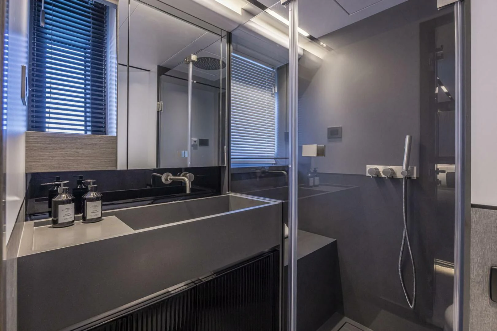 a bathroom with a sink and a window aboard KNEAD IT Yacht for Sale