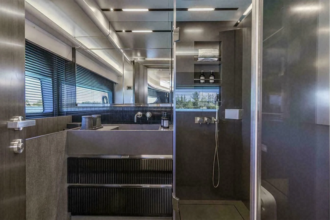 a kitchen with a glass wall aboard KNEAD IT Yacht for Sale