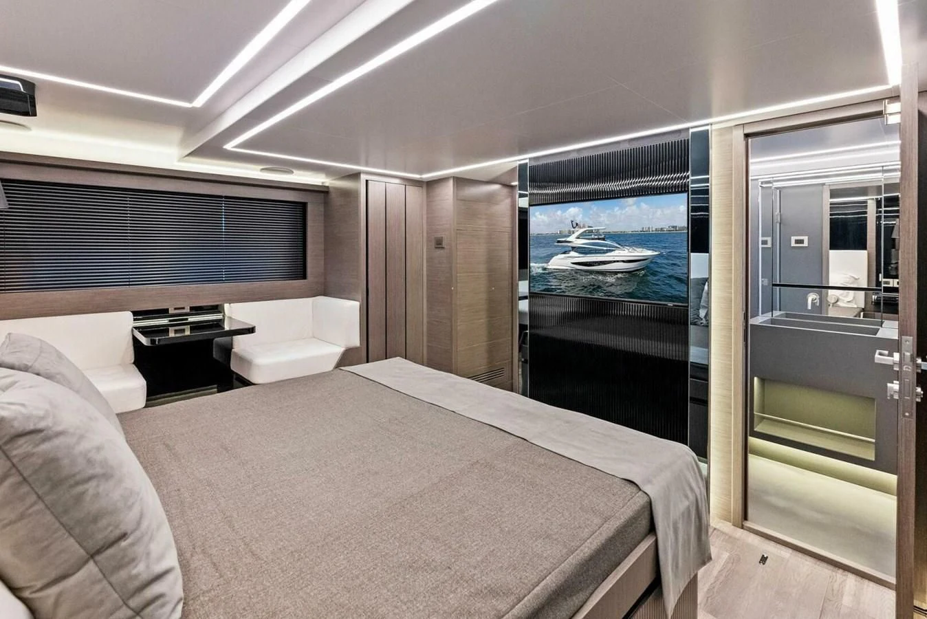 a room with a bed and a large fish tank aboard KNEAD IT Yacht for Sale