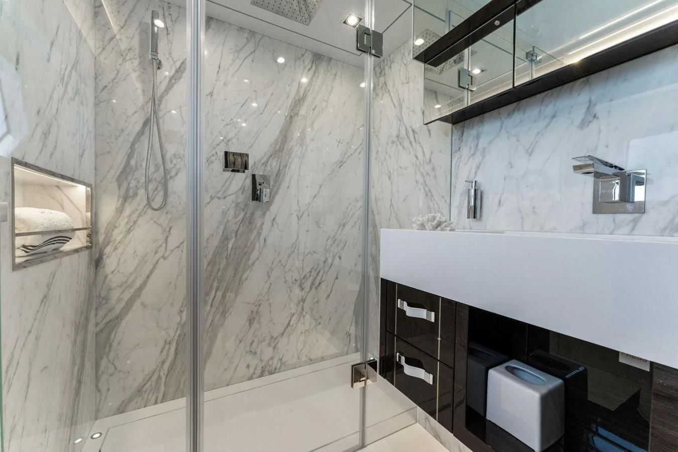 a bathroom with a shower and sink aboard KNEAD IT Yacht for Sale