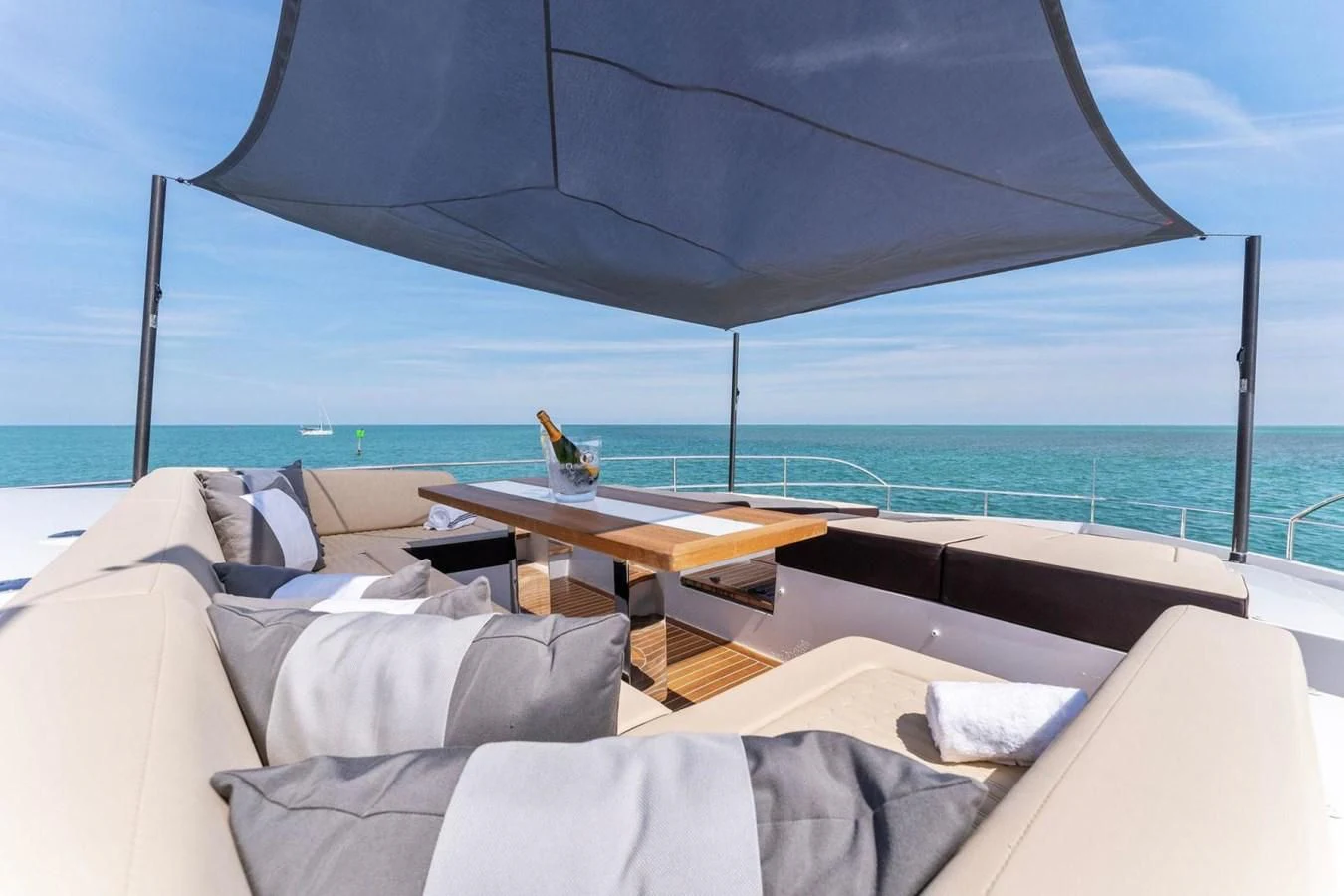 a table and a bed on a beach aboard KNEAD IT Yacht for Sale