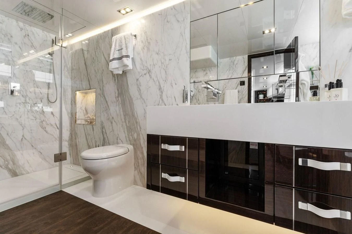 a bathroom with a glass shower aboard KNEAD IT Yacht for Sale