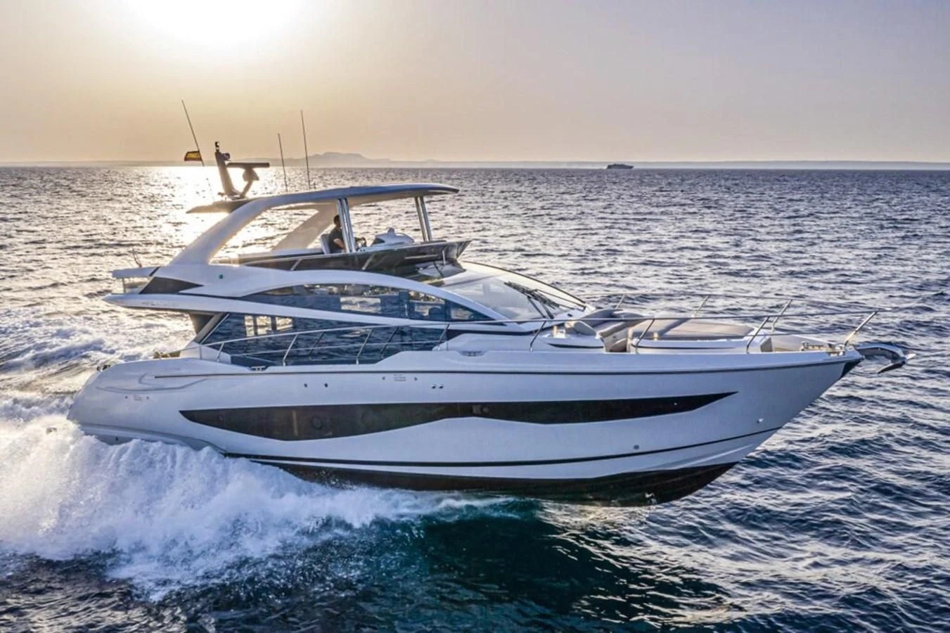 a white yacht on the water aboard KNEAD IT Yacht for Sale