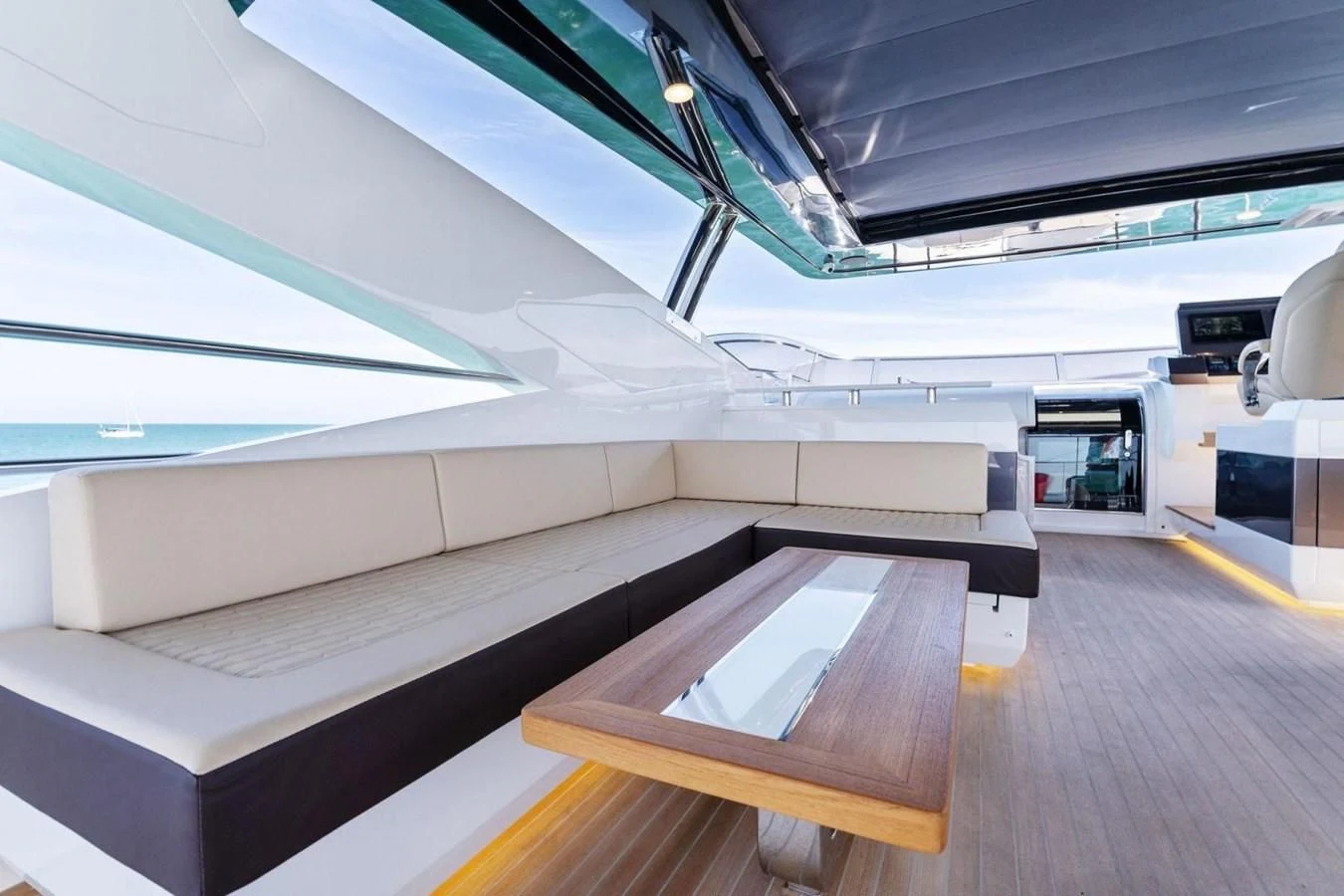 a room with a wood table and a large white wall aboard KNEAD IT Yacht for Sale