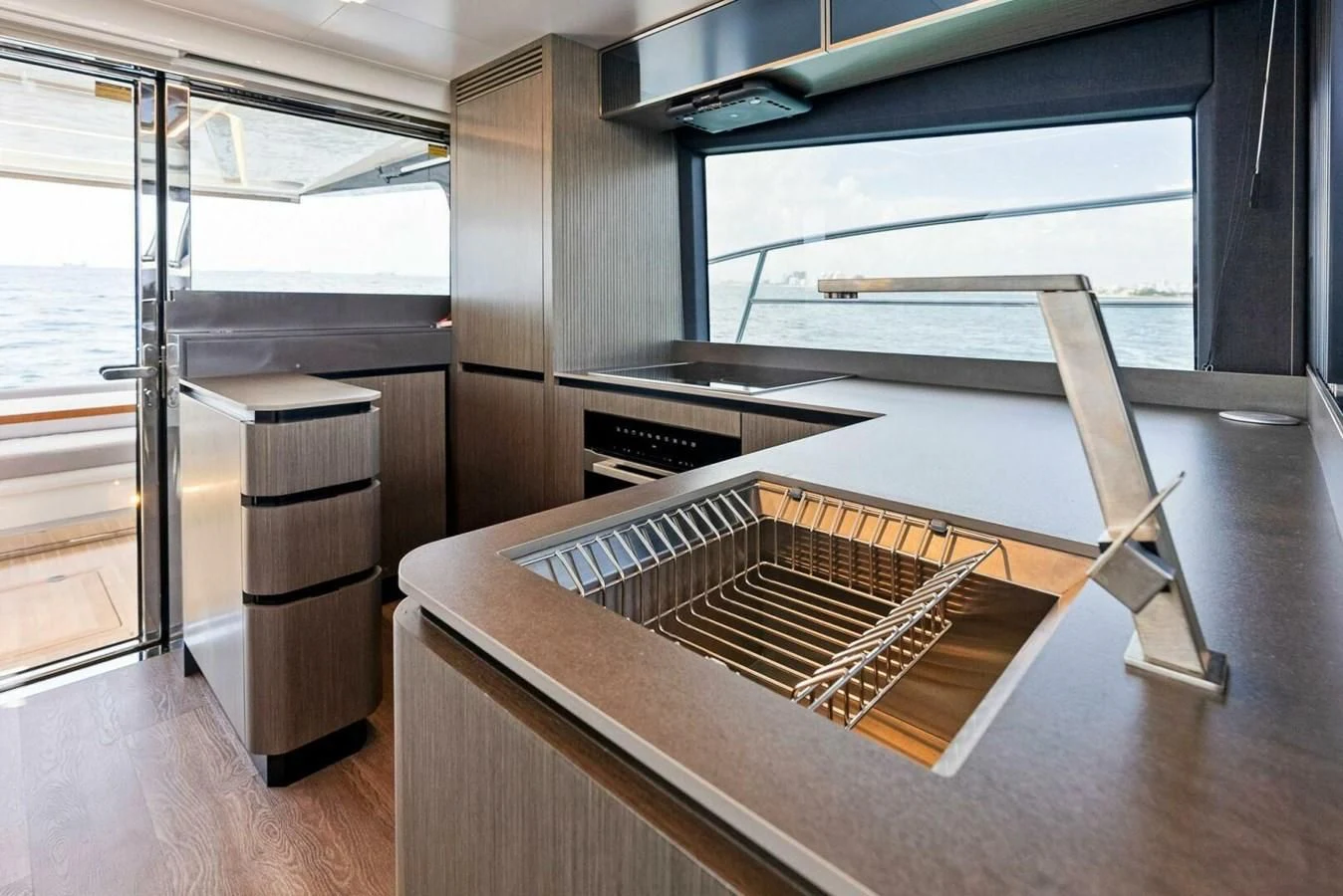 a large kitchen with a large window aboard KNEAD IT Yacht for Sale
