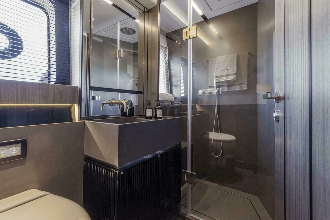 a bathroom with a glass shower aboard KNEAD IT Yacht for Sale