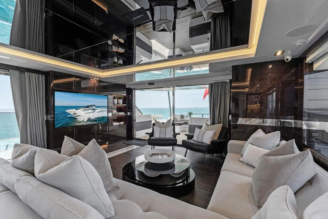 a room with a large screen aboard KNEAD IT Yacht for Sale