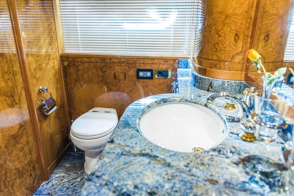 a bathroom with a sink and toilet aboard HEMERA CUARTA Yacht for Sale