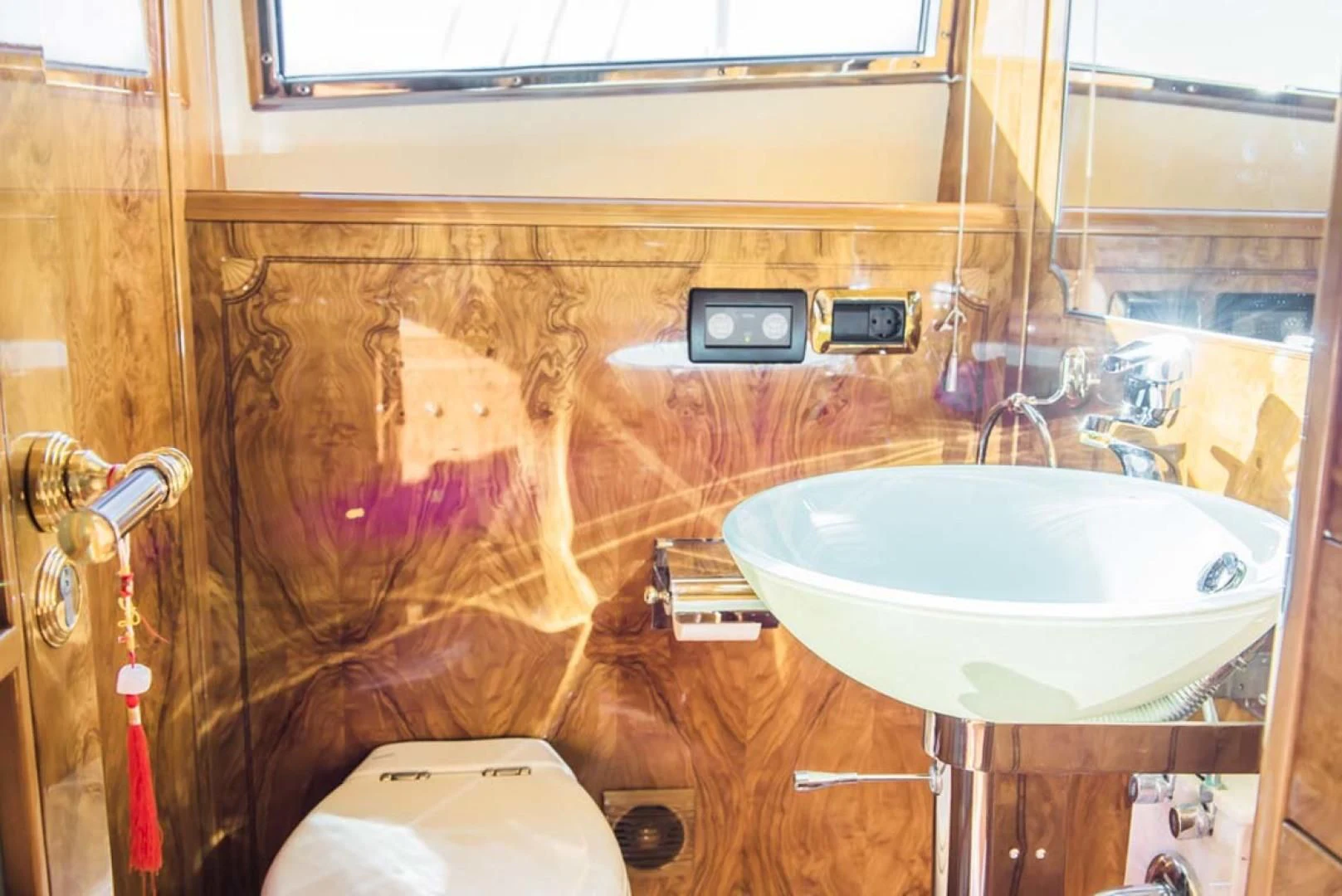 a bathroom with a sink and toilet aboard HEMERA CUARTA Yacht for Sale