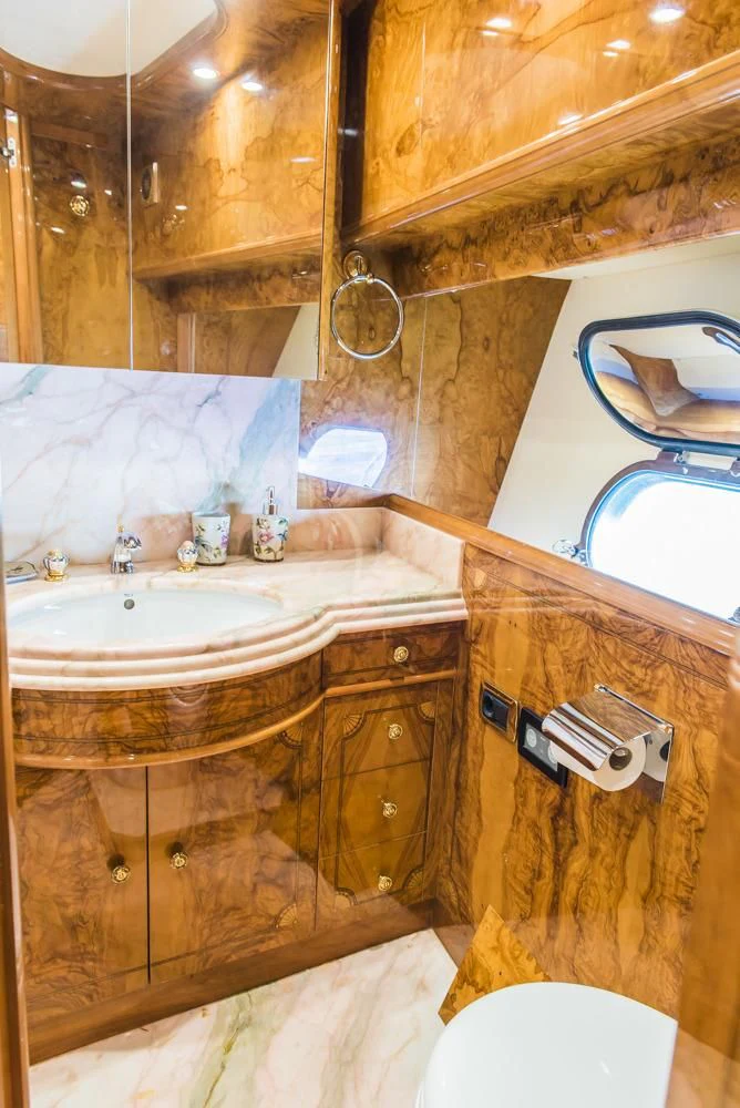 a bathroom with a sink and a mirror aboard HEMERA CUARTA Yacht for Sale