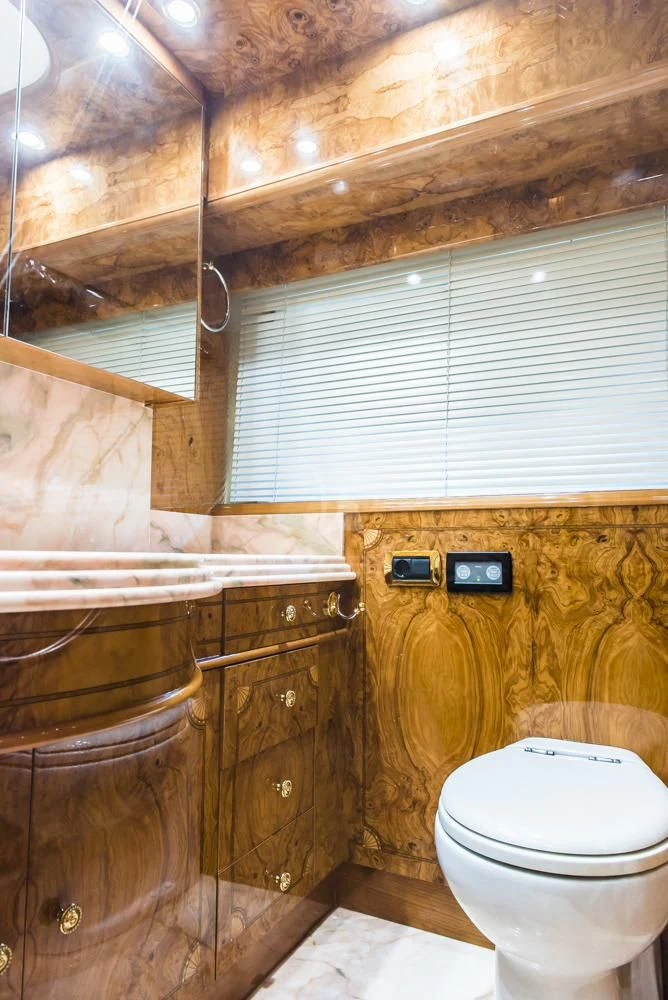 a bathroom with a toilet and a sink aboard HEMERA CUARTA Yacht for Sale