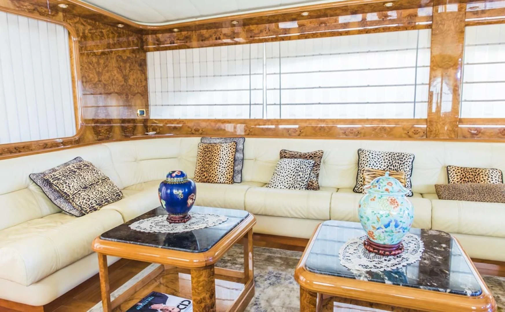 a living room with a couch and a table aboard HEMERA CUARTA Yacht for Sale
