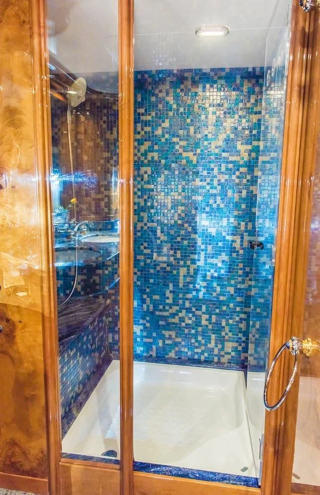 a shower with a glass door aboard HEMERA CUARTA Yacht for Sale