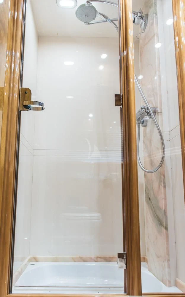 a shower with a glass door aboard HEMERA CUARTA Yacht for Sale