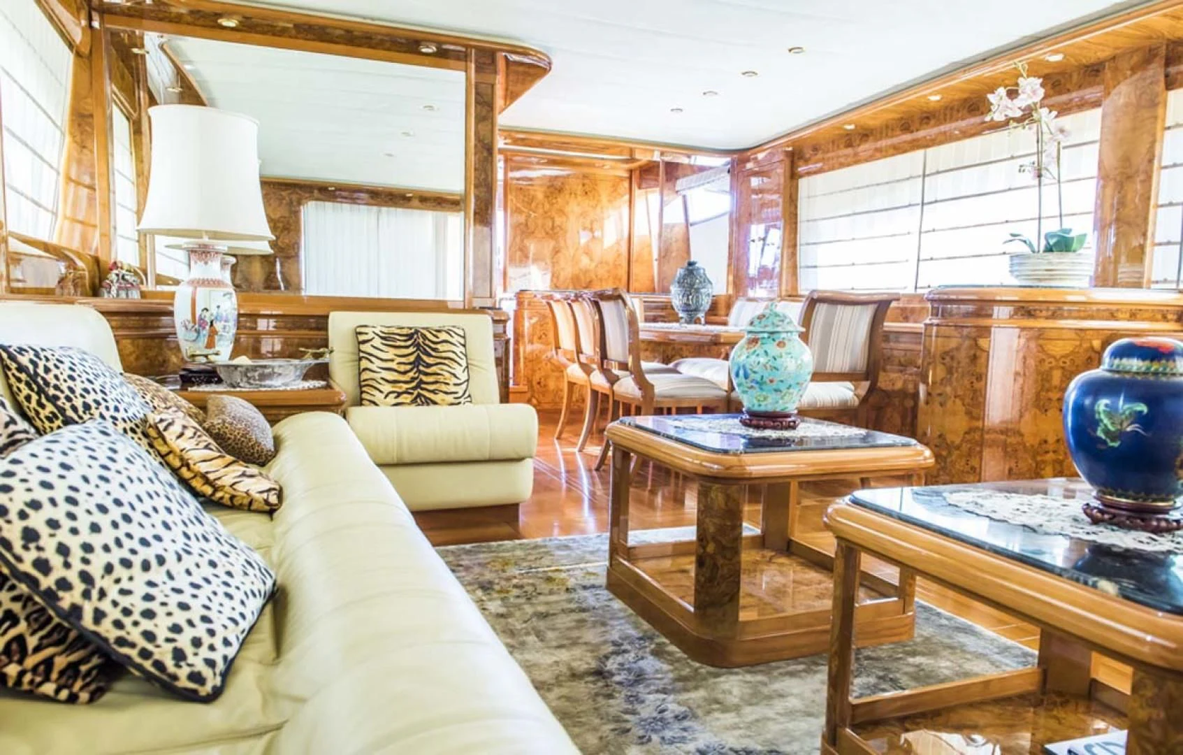 a living room with a couch and a table aboard HEMERA CUARTA Yacht for Sale