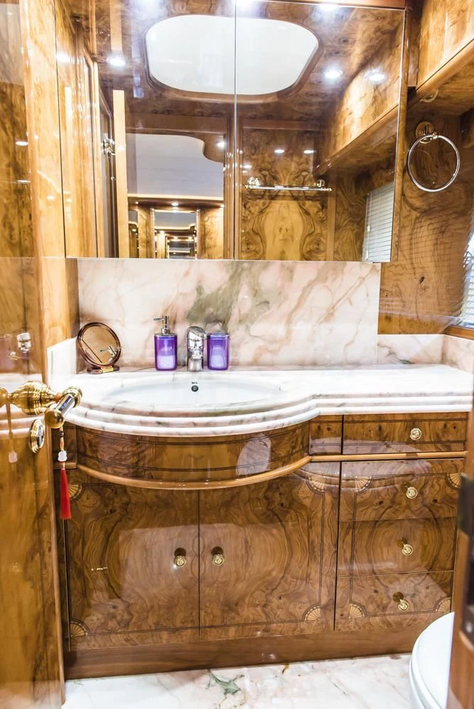 a bathroom with a sink and a mirror aboard HEMERA CUARTA Yacht for Sale