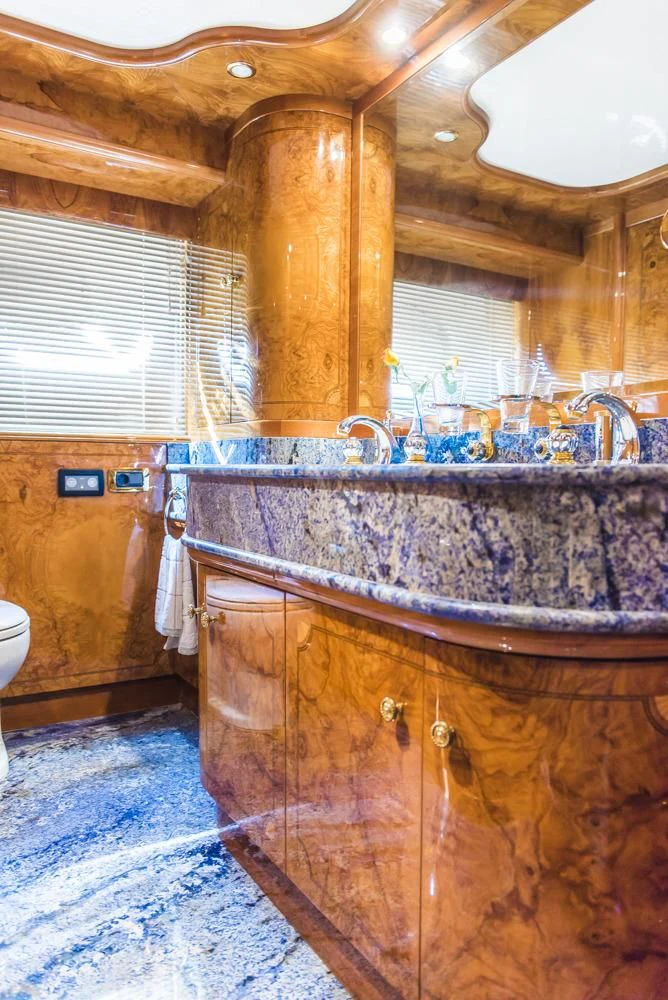 a bathroom with a marble counter top aboard HEMERA CUARTA Yacht for Sale