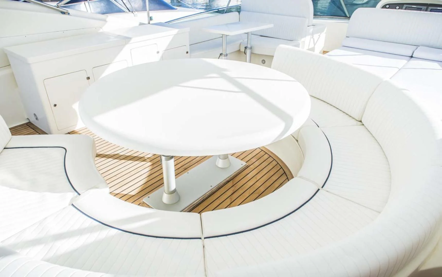 a round white table with a white center aboard HEMERA CUARTA Yacht for Sale