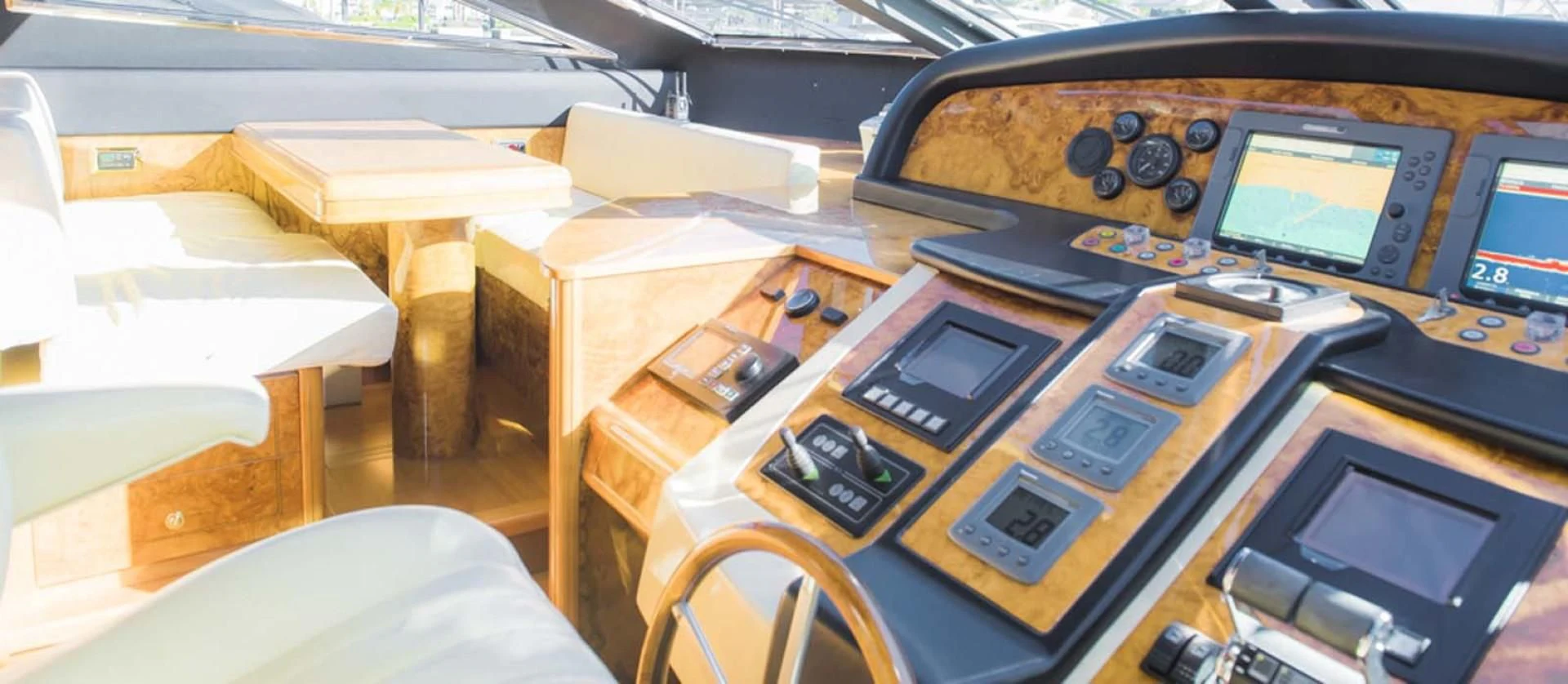 a table with many electronic devices on it aboard HEMERA CUARTA Yacht for Sale