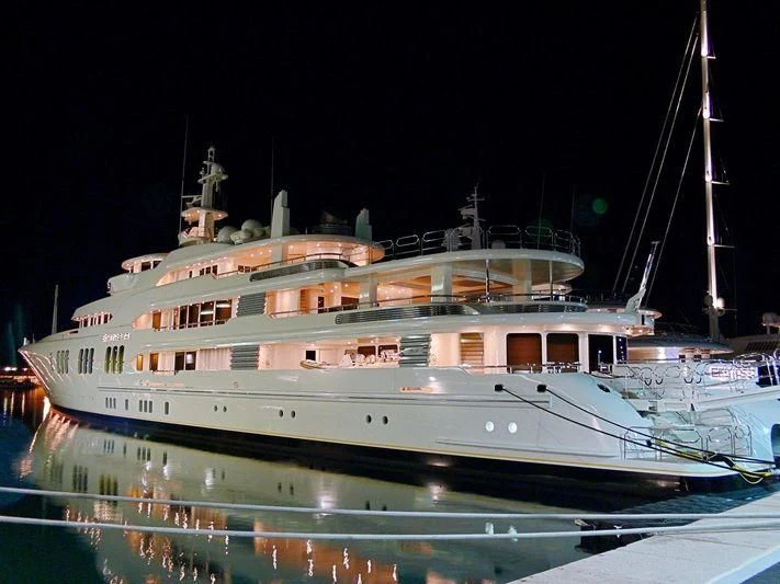 a large cruise ship at night aboard ECSTASEA Yacht for Sale