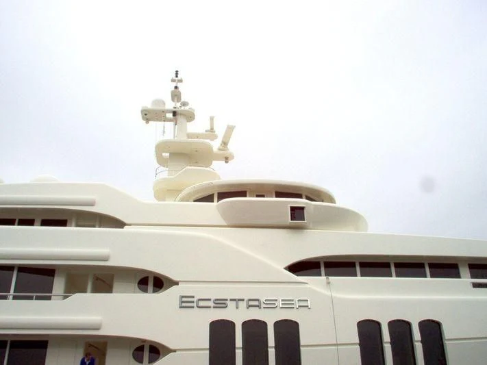 a white building with a statue on top aboard ECSTASEA Yacht for Sale