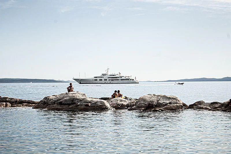a boat in the water with a boat in the background aboard ECSTASEA Yacht for Sale
