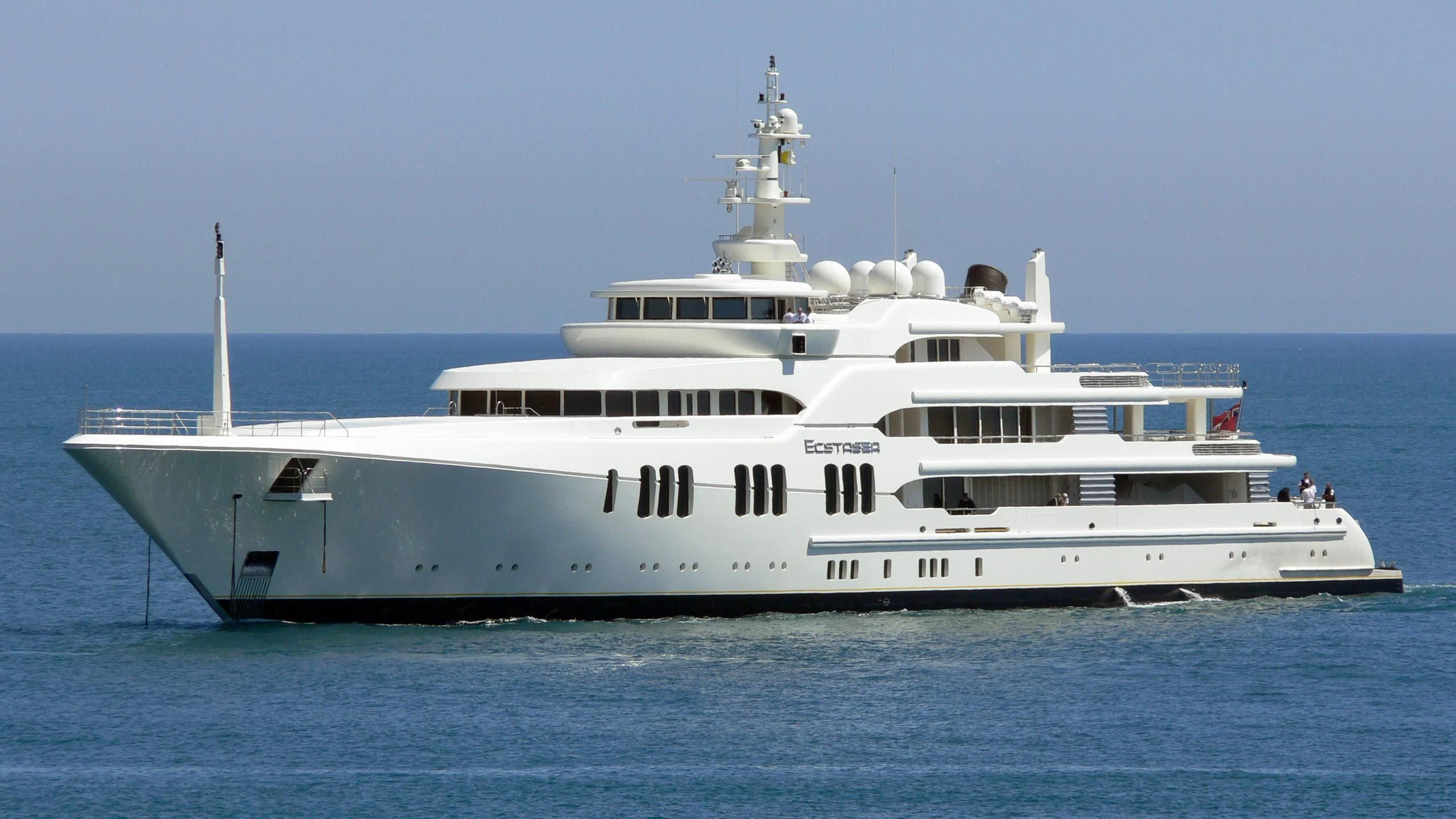 a large white boat in the water aboard ECSTASEA Yacht for Sale