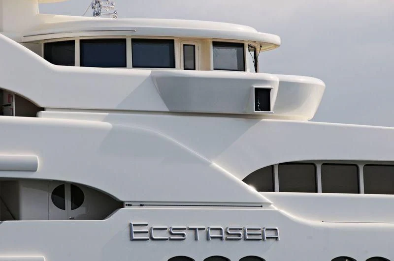 a white car with a white roof aboard ECSTASEA Yacht for Sale