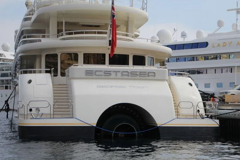 a large white boat in the water aboard ECSTASEA Yacht for Sale