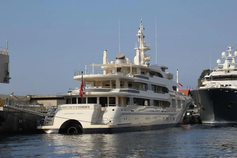 a large white boat in the water aboard ECSTASEA Yacht for Sale