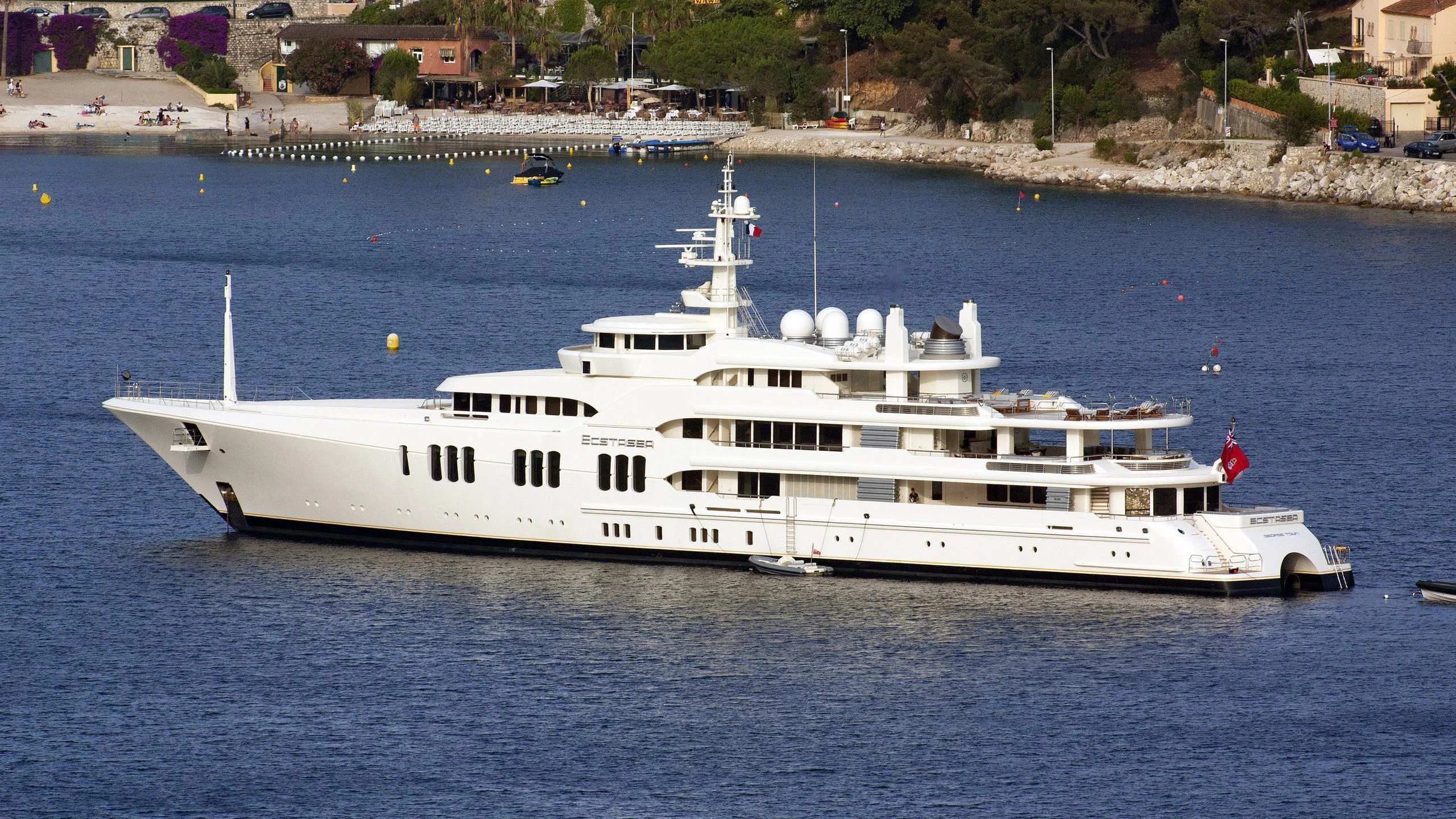 a large white boat in the water aboard ECSTASEA Yacht for Sale