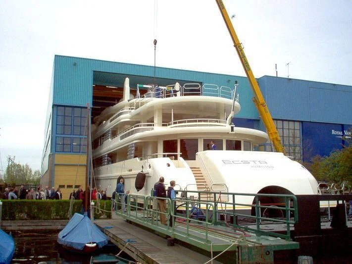 a boat docked at a pier aboard ECSTASEA Yacht for Sale