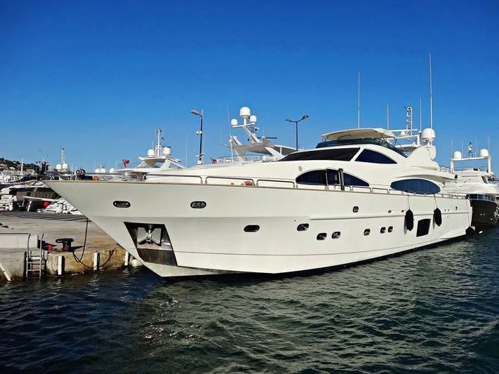 a white yacht in the water aboard DOLCE VITA IV Yacht for Sale
