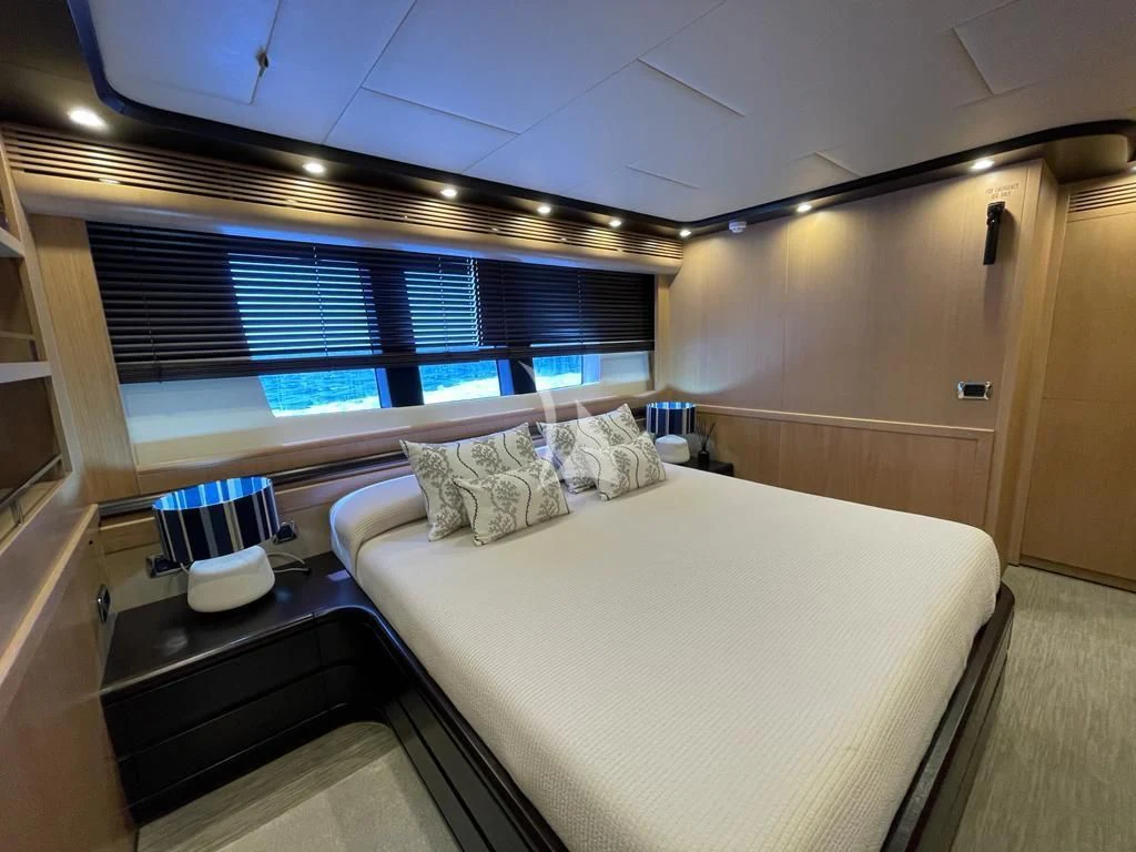 a room with a bed and a window aboard DOLCE VITA IV Yacht for Sale