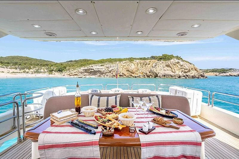 a table on a boat aboard DOLCE VITA IV Yacht for Sale