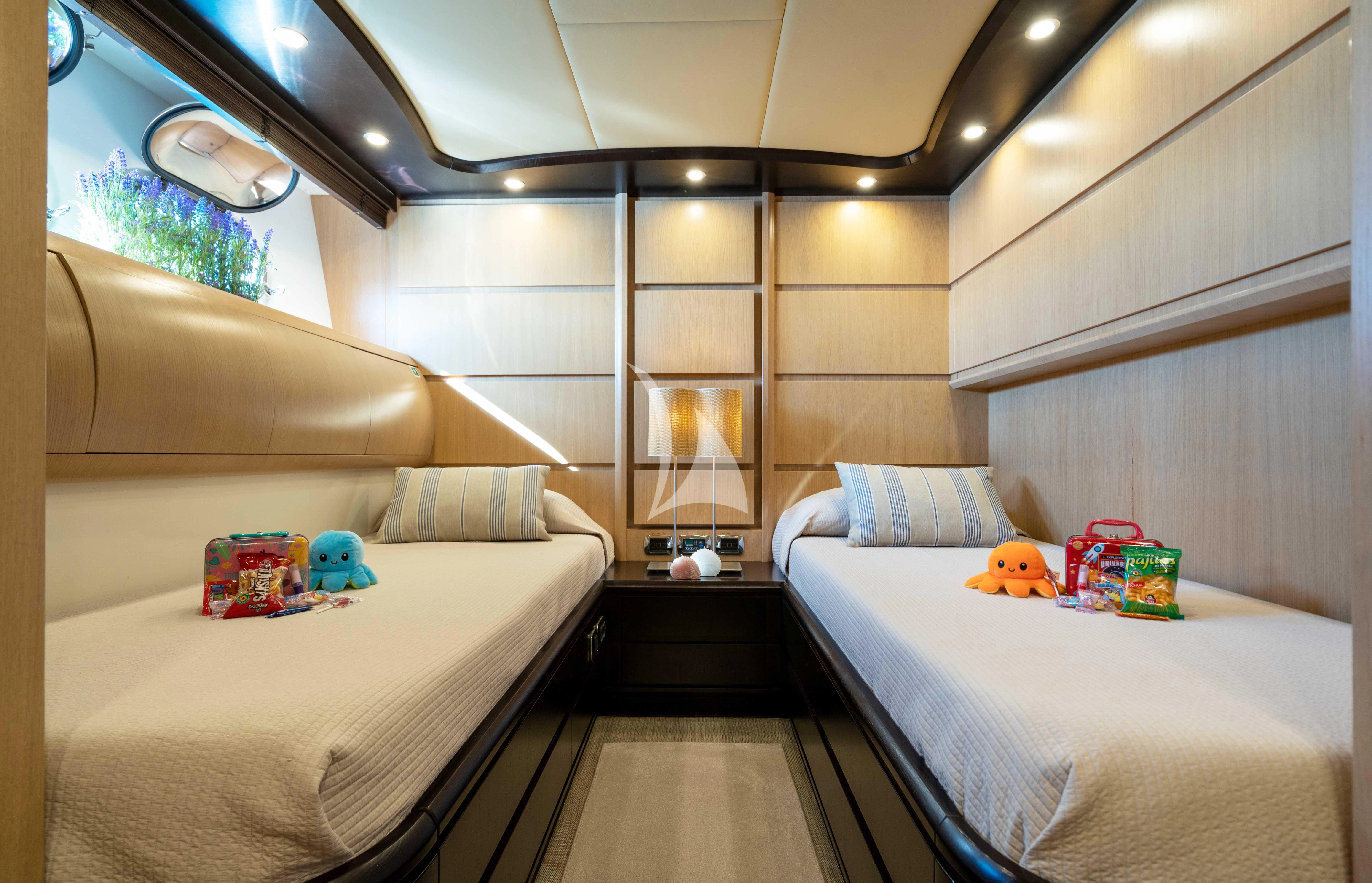 a room with two beds aboard DOLCE VITA IV Yacht for Sale