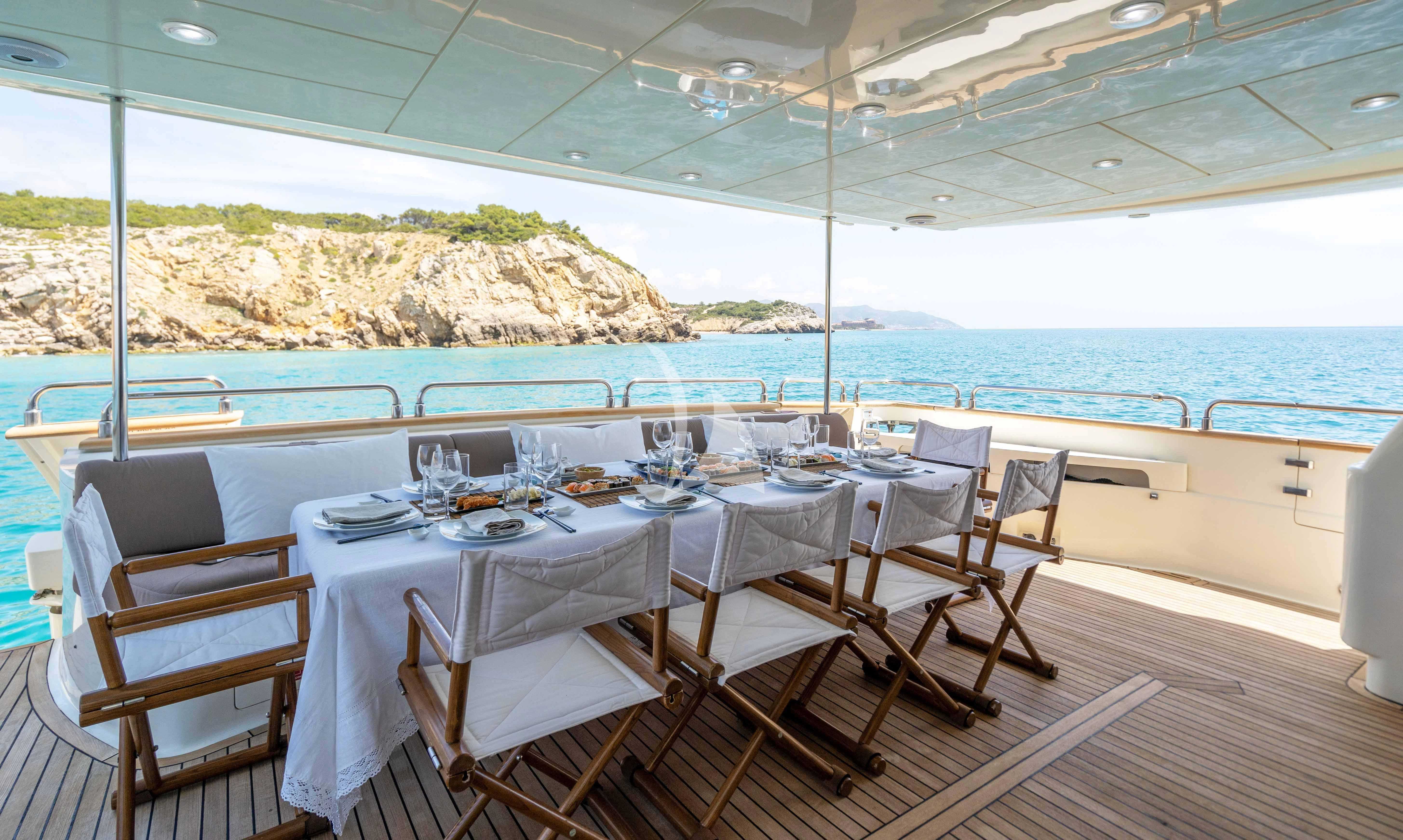 a table set for a meal aboard DOLCE VITA IV Yacht for Sale