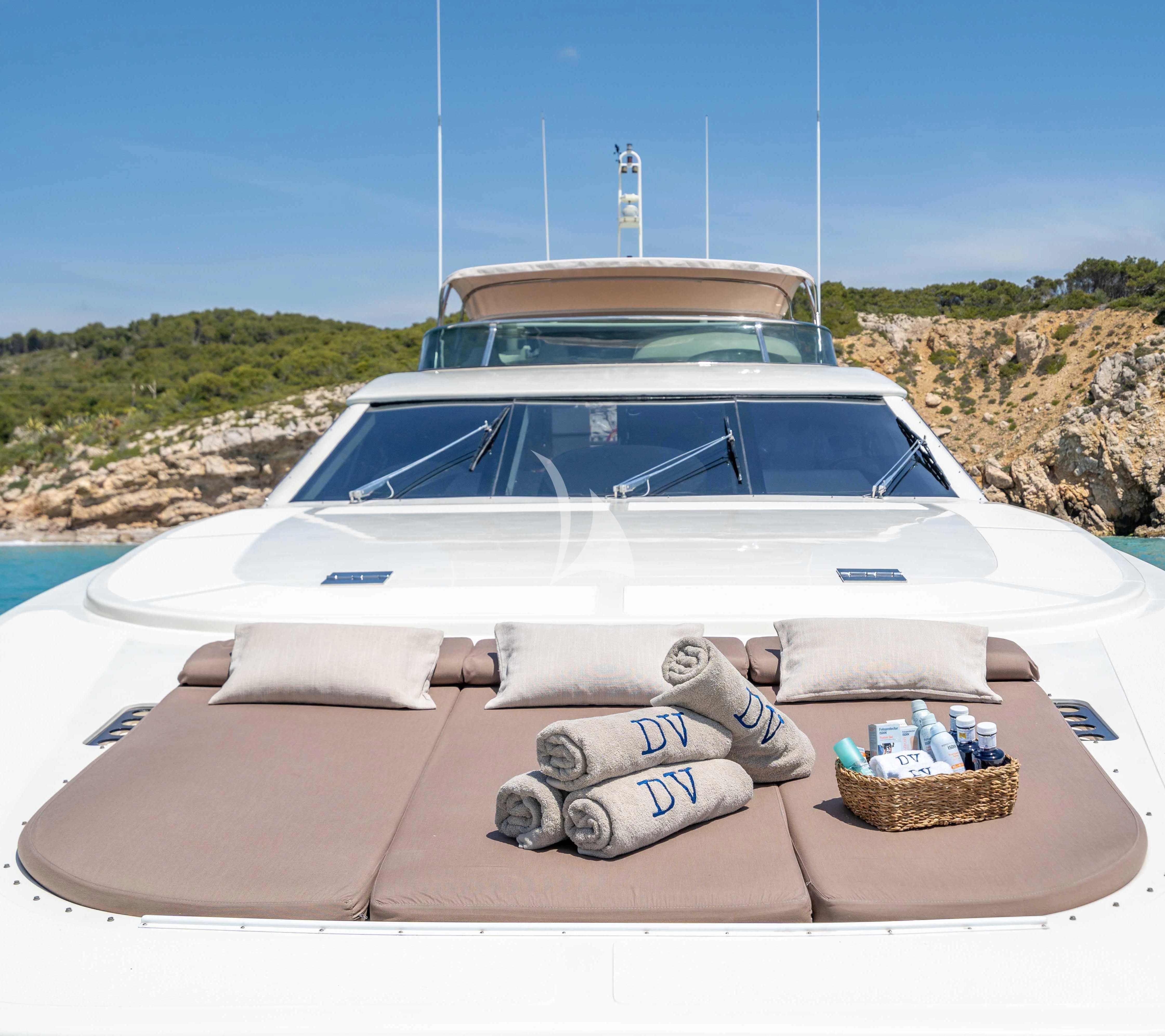 a white car on a beach aboard DOLCE VITA IV Yacht for Sale