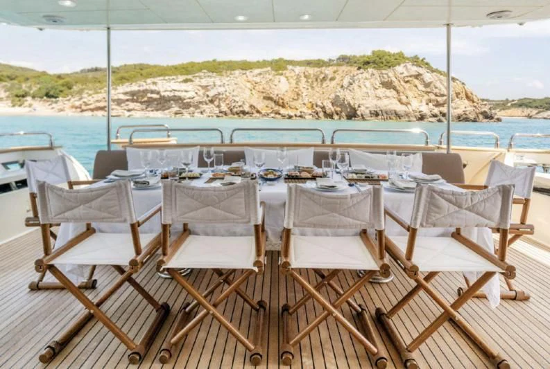 a group of chairs on a beach aboard DOLCE VITA IV Yacht for Sale