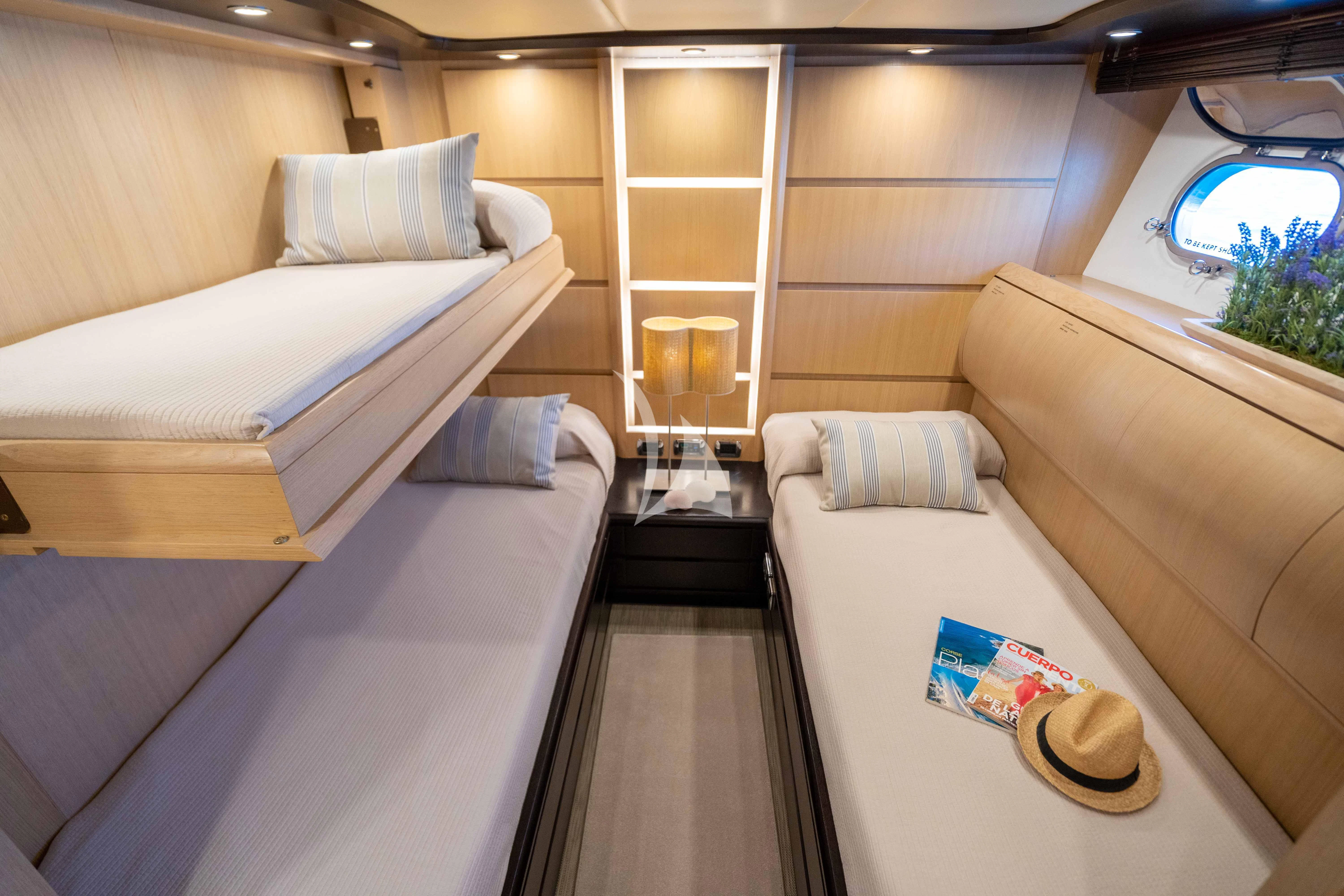a room with two beds aboard DOLCE VITA IV Yacht for Sale