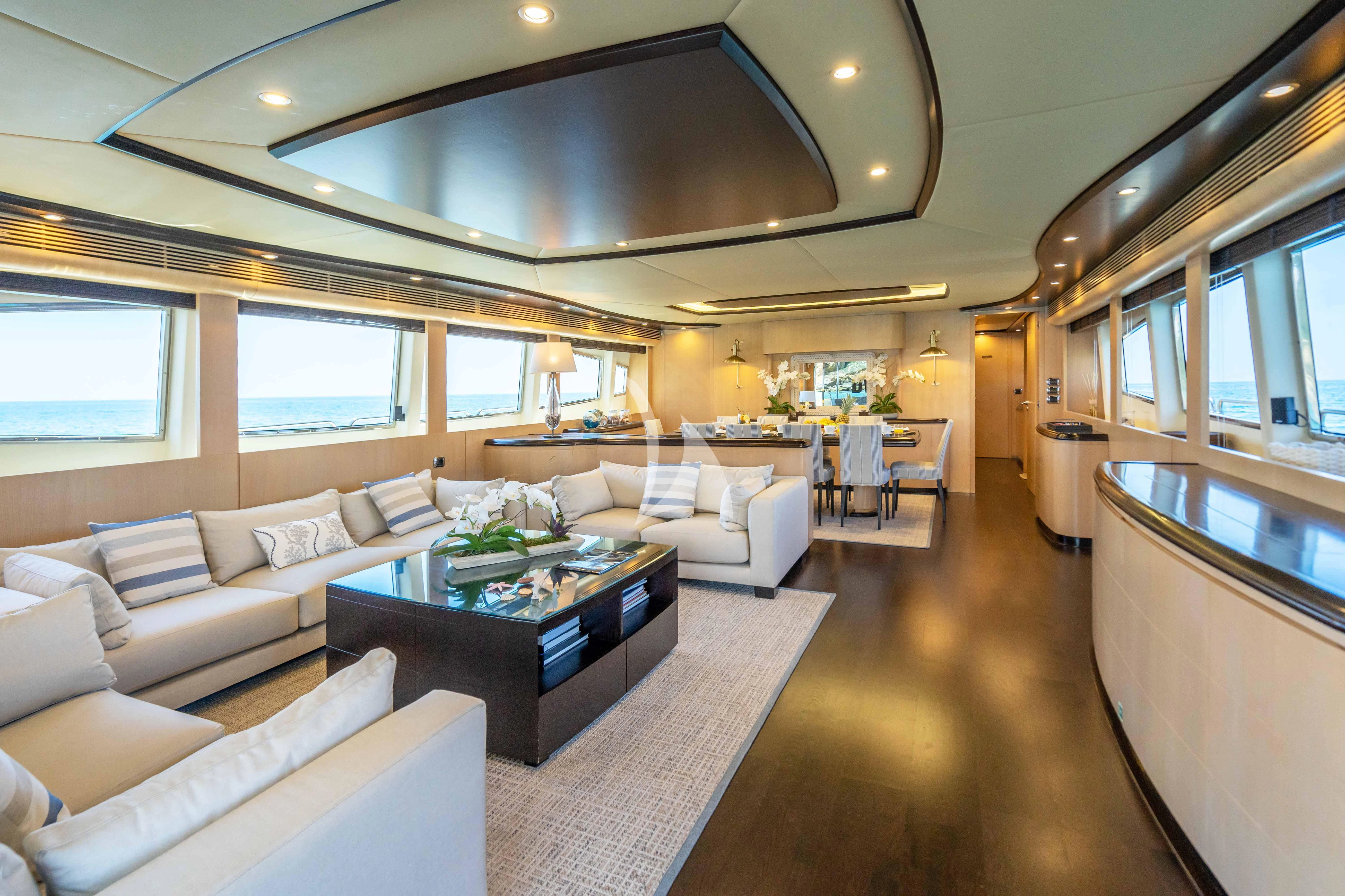 a living room with a large mirror aboard DOLCE VITA IV Yacht for Sale